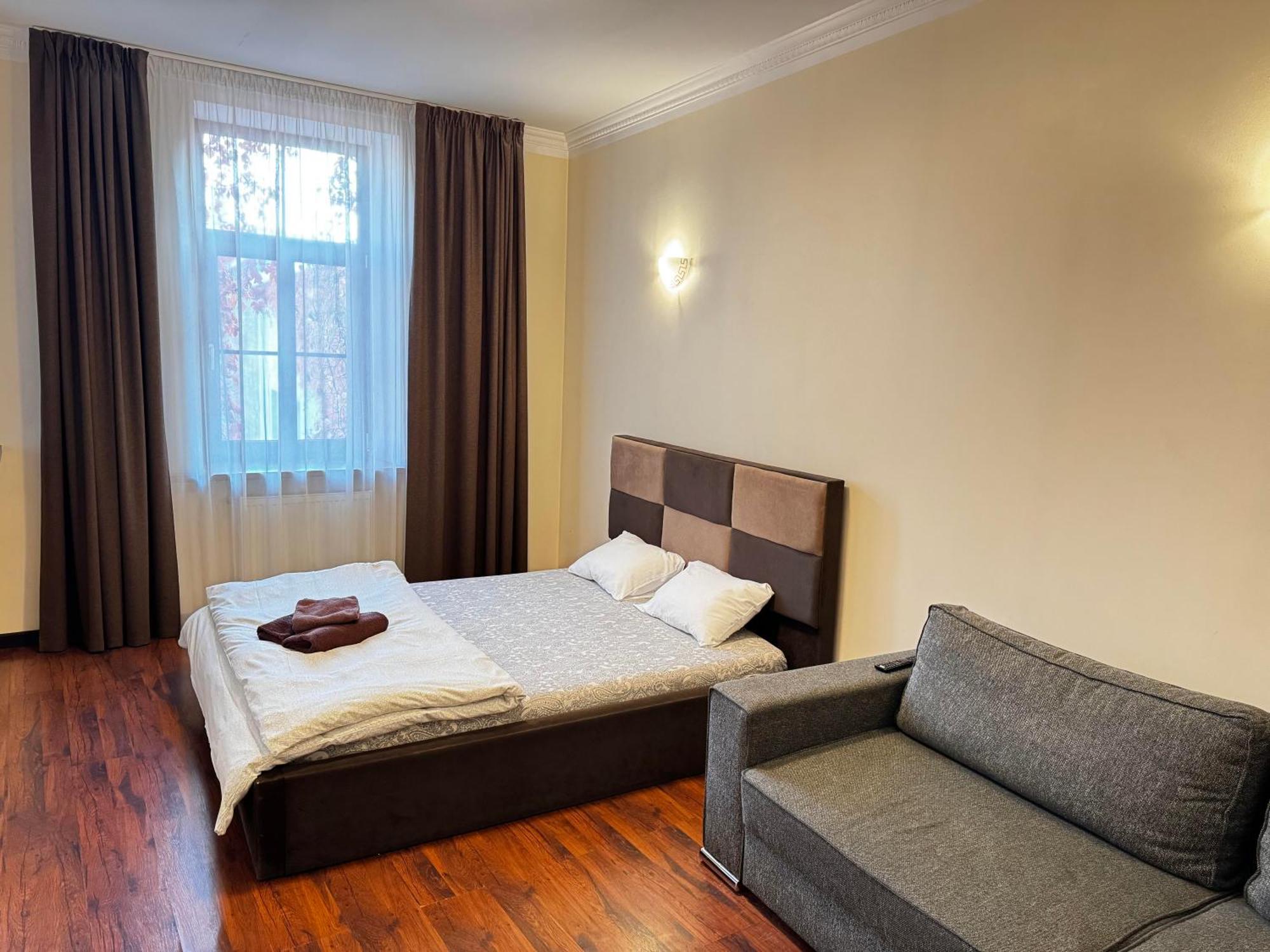 Aparthotel ريغا المظهر الخارجي الصورة A bedroom in a hotel