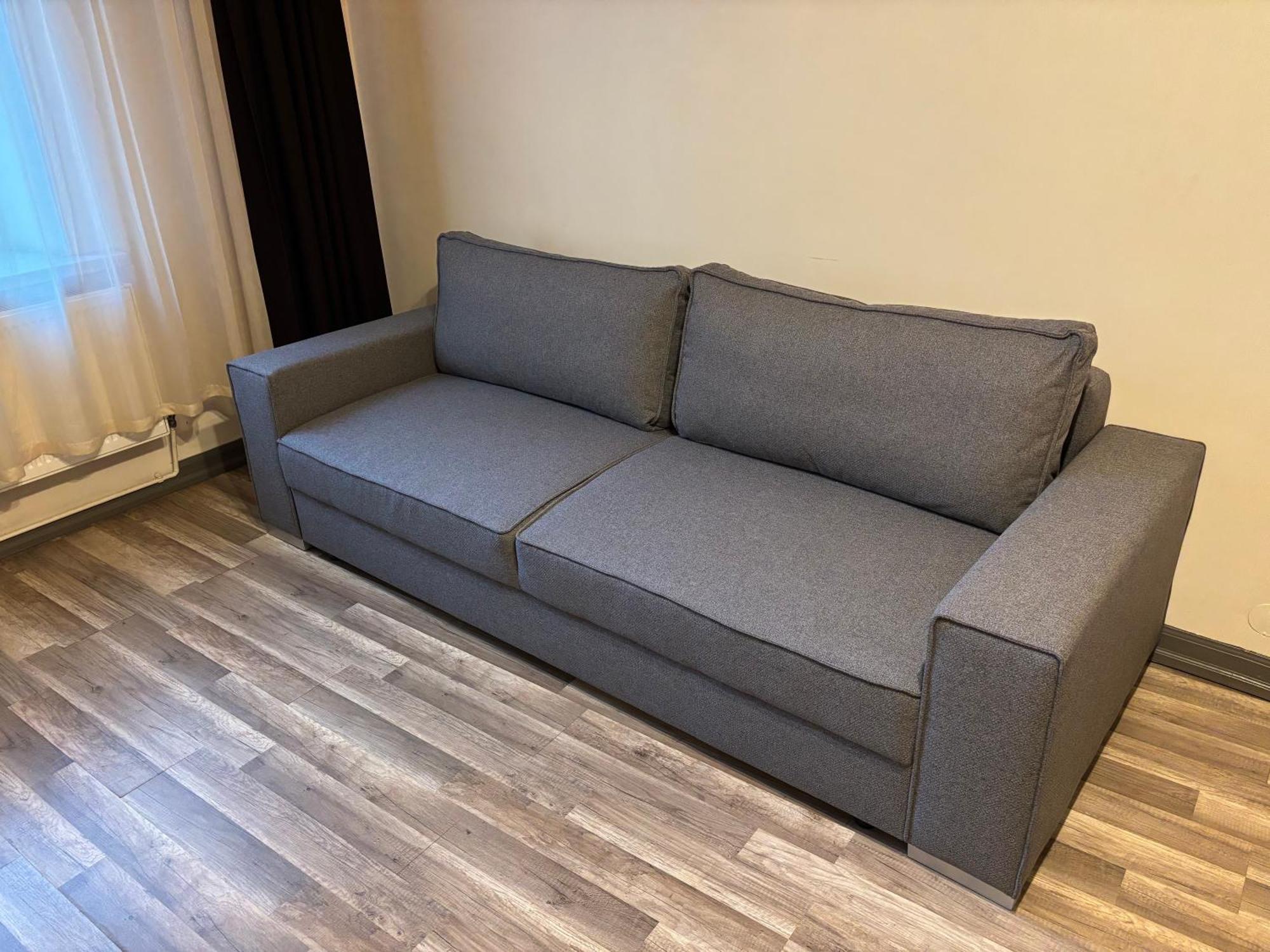 Aparthotel ريغا المظهر الخارجي الصورة A sofa