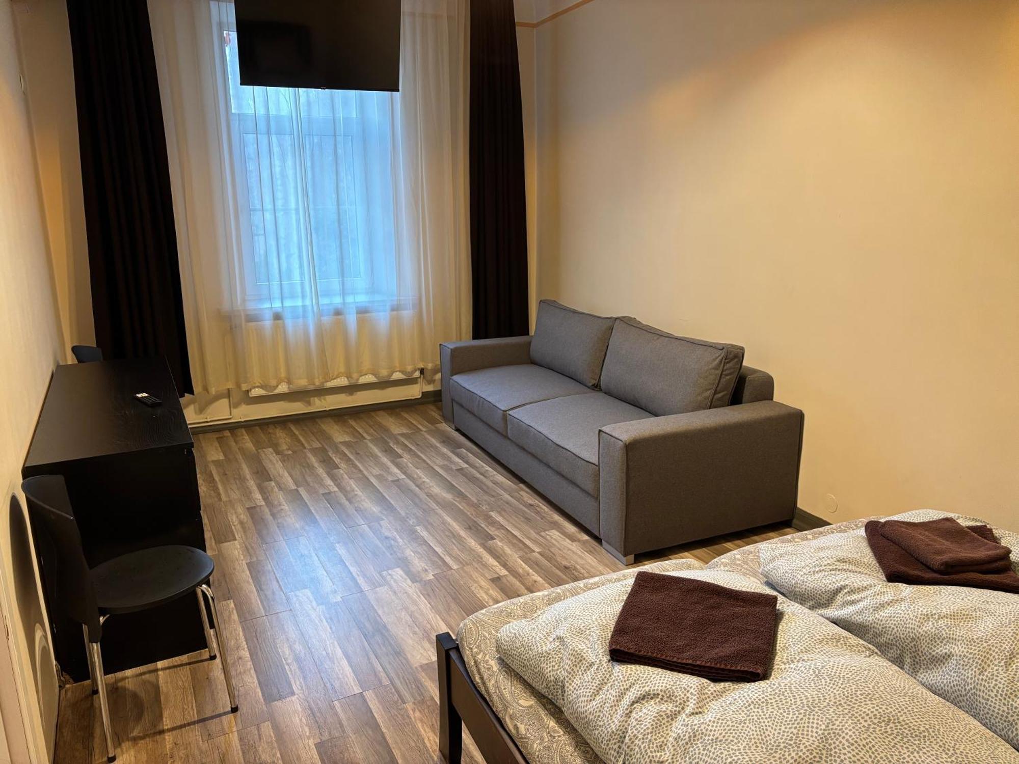 Aparthotel ريغا المظهر الخارجي الصورة A typical room at the hostel